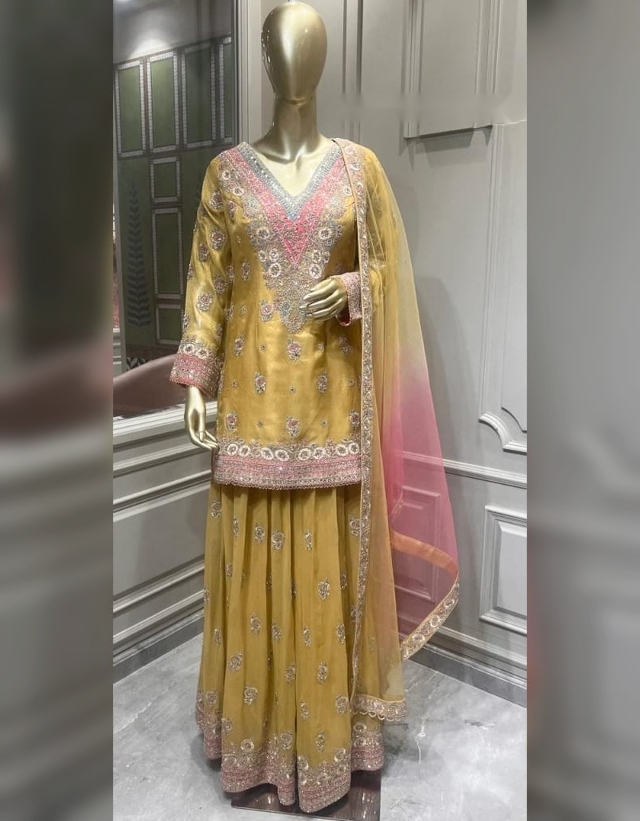 Mustard embroidered sharara suit with pink dupatta at Raunak Boutique Epping, Melbourne